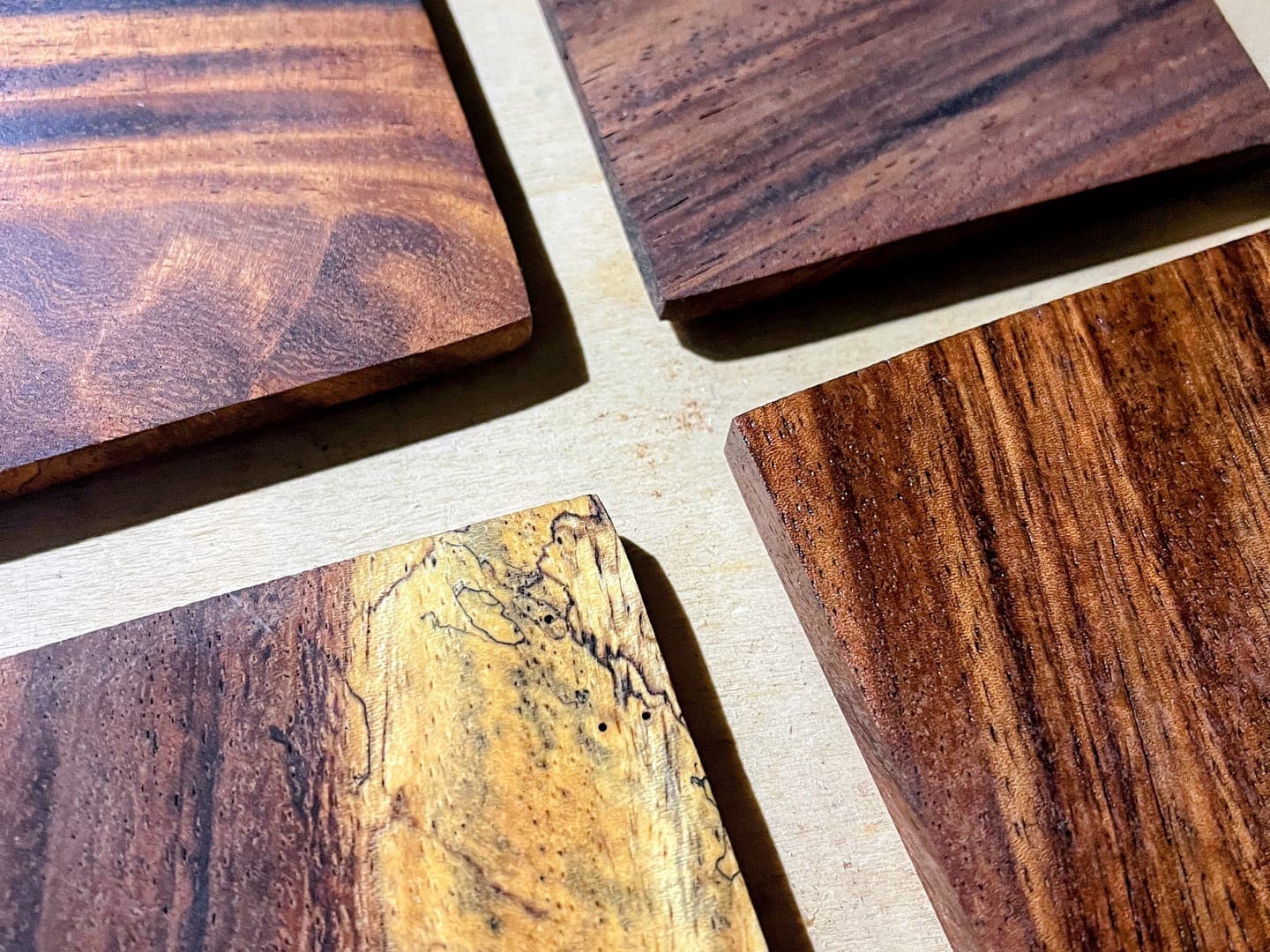 Heritage American Woodworks: a set of solid hardwood coasters laid out on the bench
