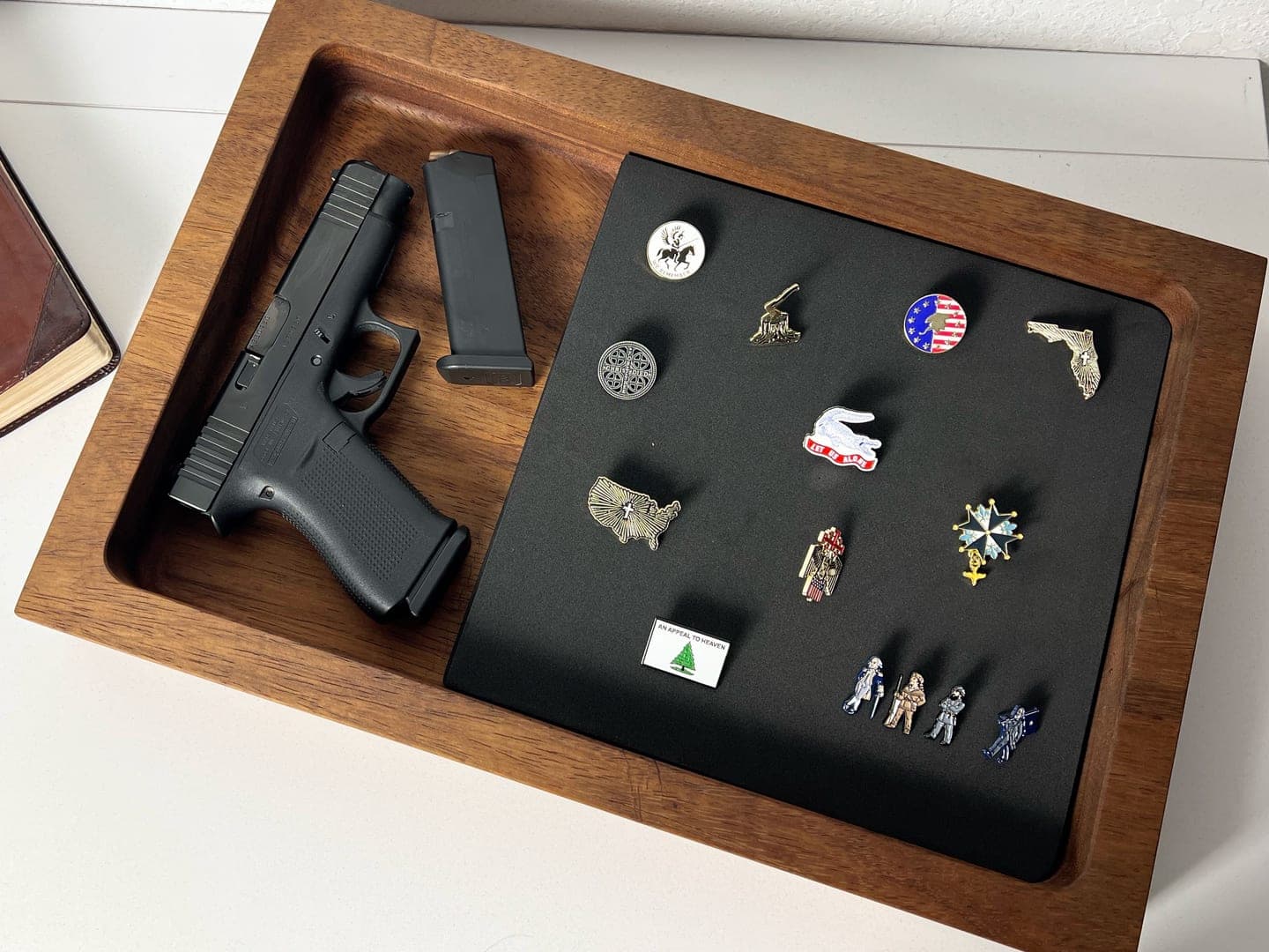 Heritage American Woodworks: a solid walnut everyday carry tray holding a pistol, a magazine, and a board of enamel pins