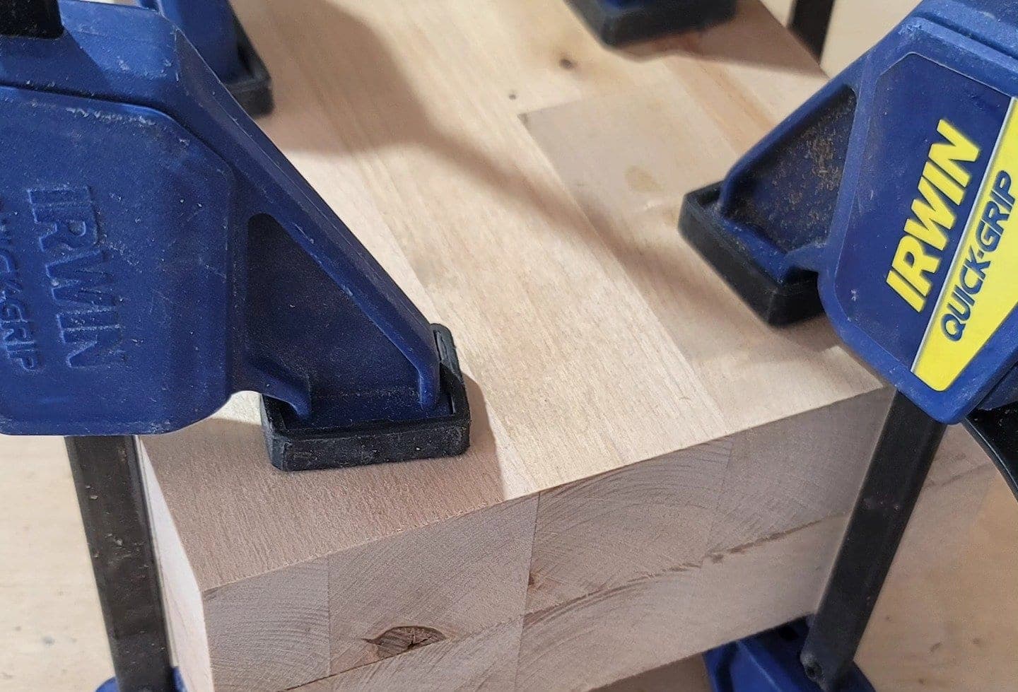 Heritage American Woodworks: hardwood boards clamped together in the shop while the glue cures