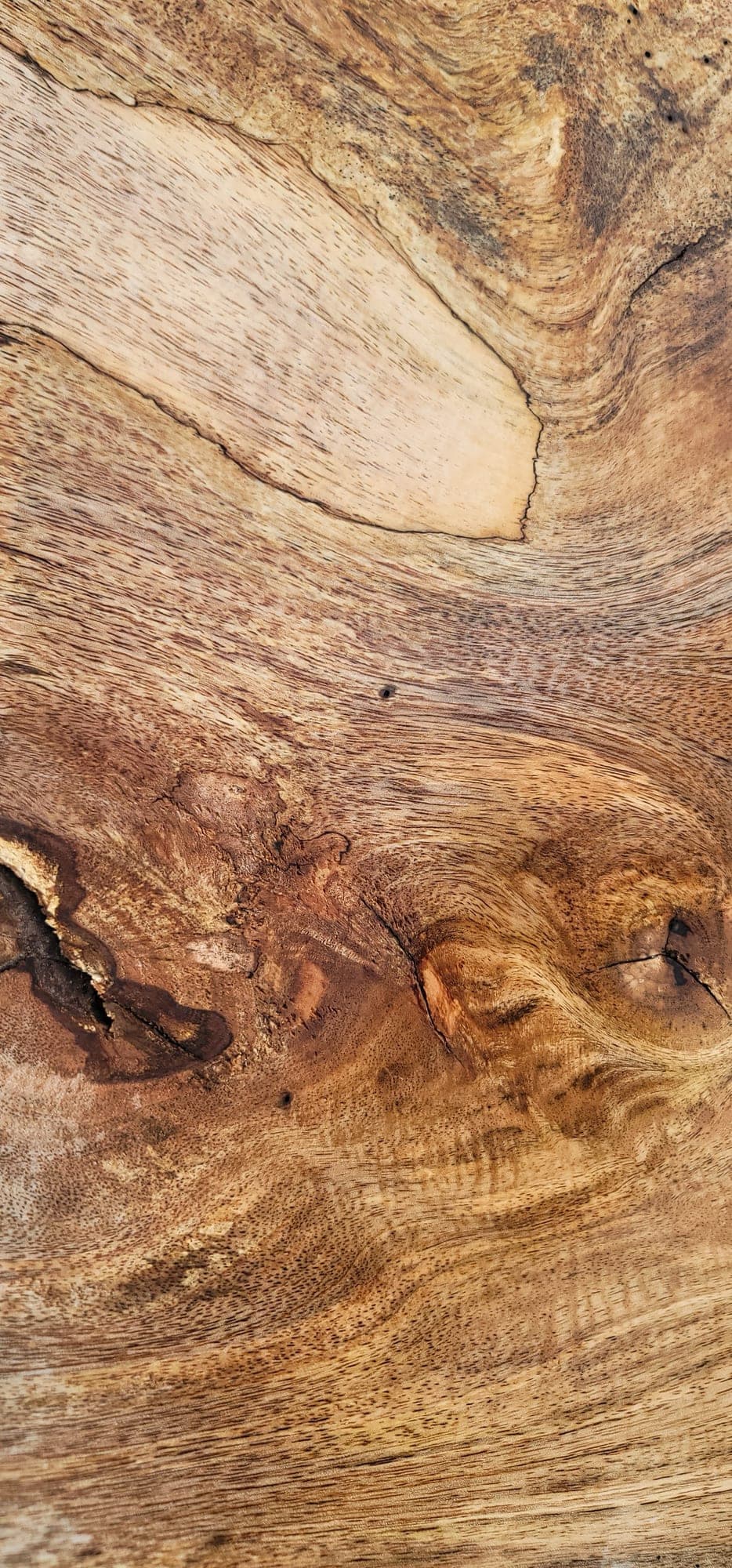 Heritage American Woodworks: figured monkeypod grain running the length of a finished top