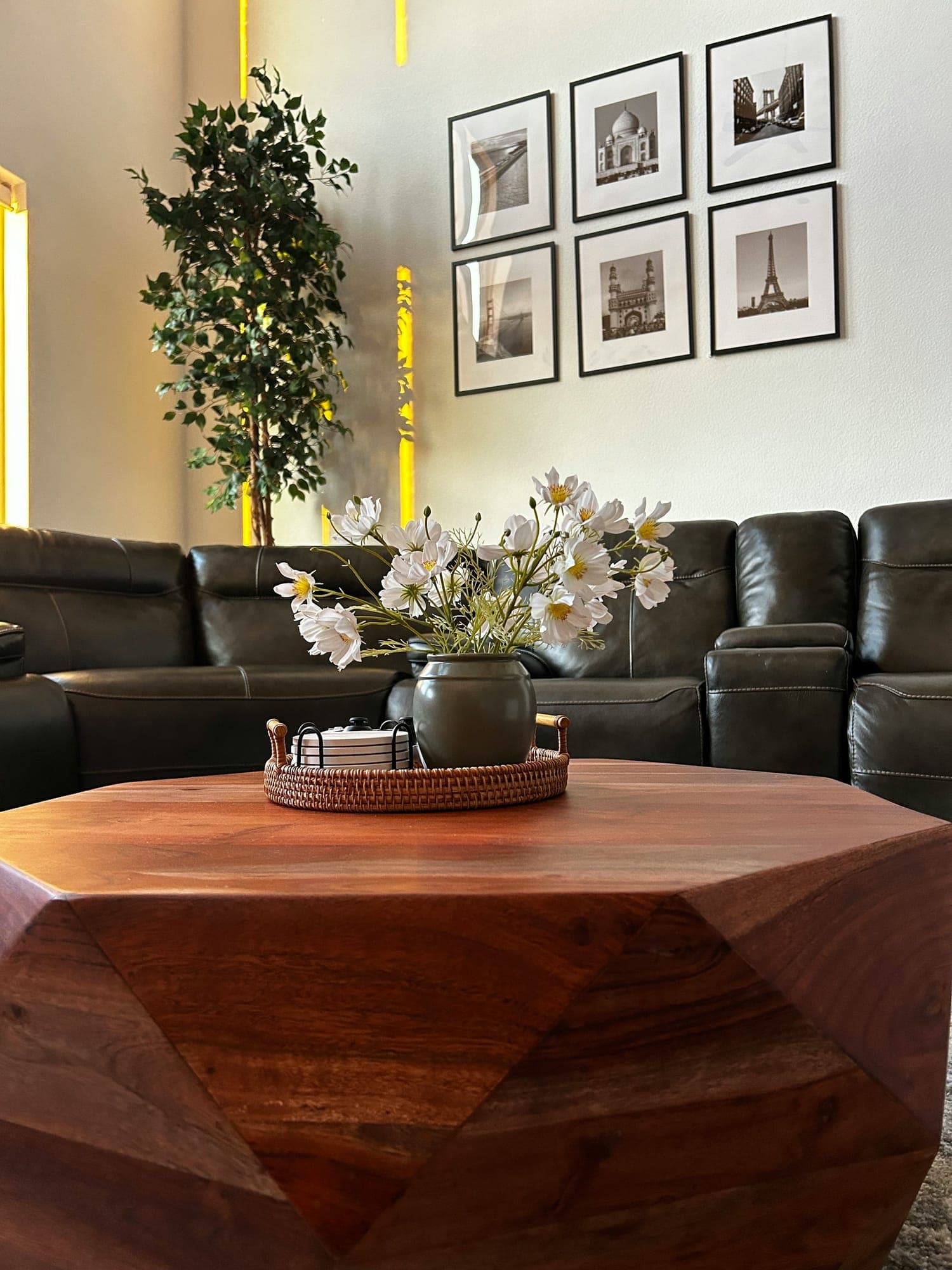 A faceted solid walnut coffee table in a living room